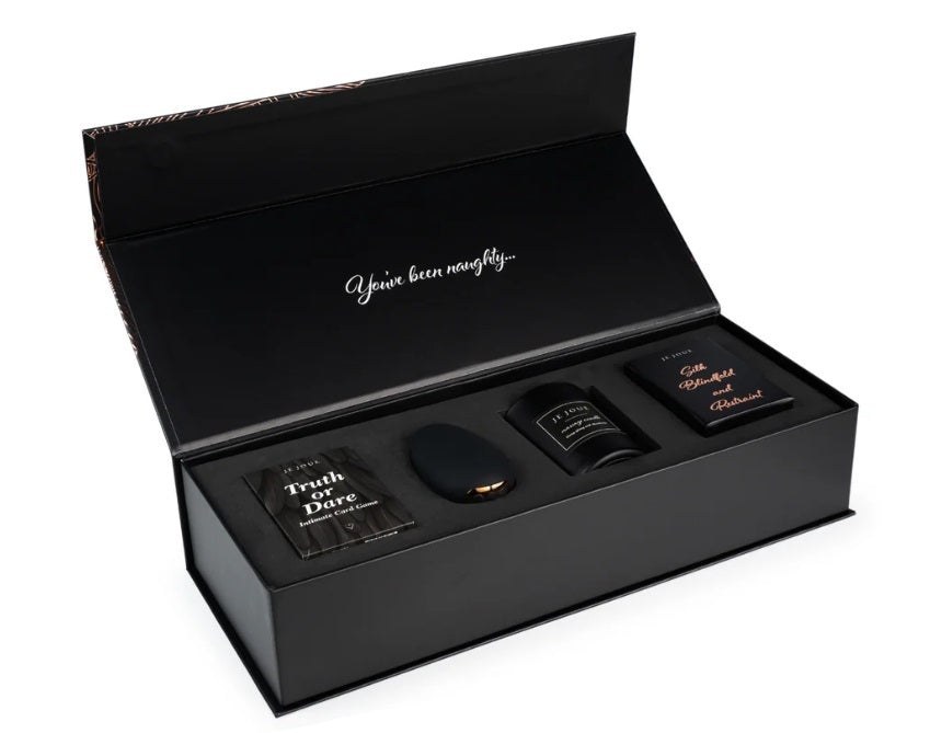 Je Joue Naughty Gift Set with massager, candle, blindfold and card game in its box