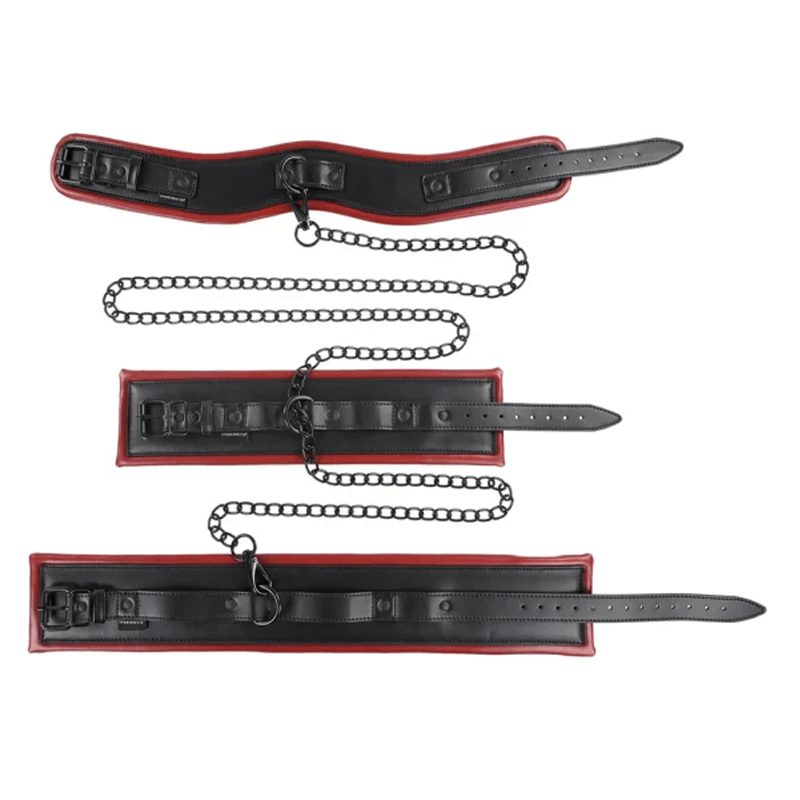 Matching red-trimmed faux-leather collar, wrist cuffs and ankle cuffs connected by a chain, laid flat
